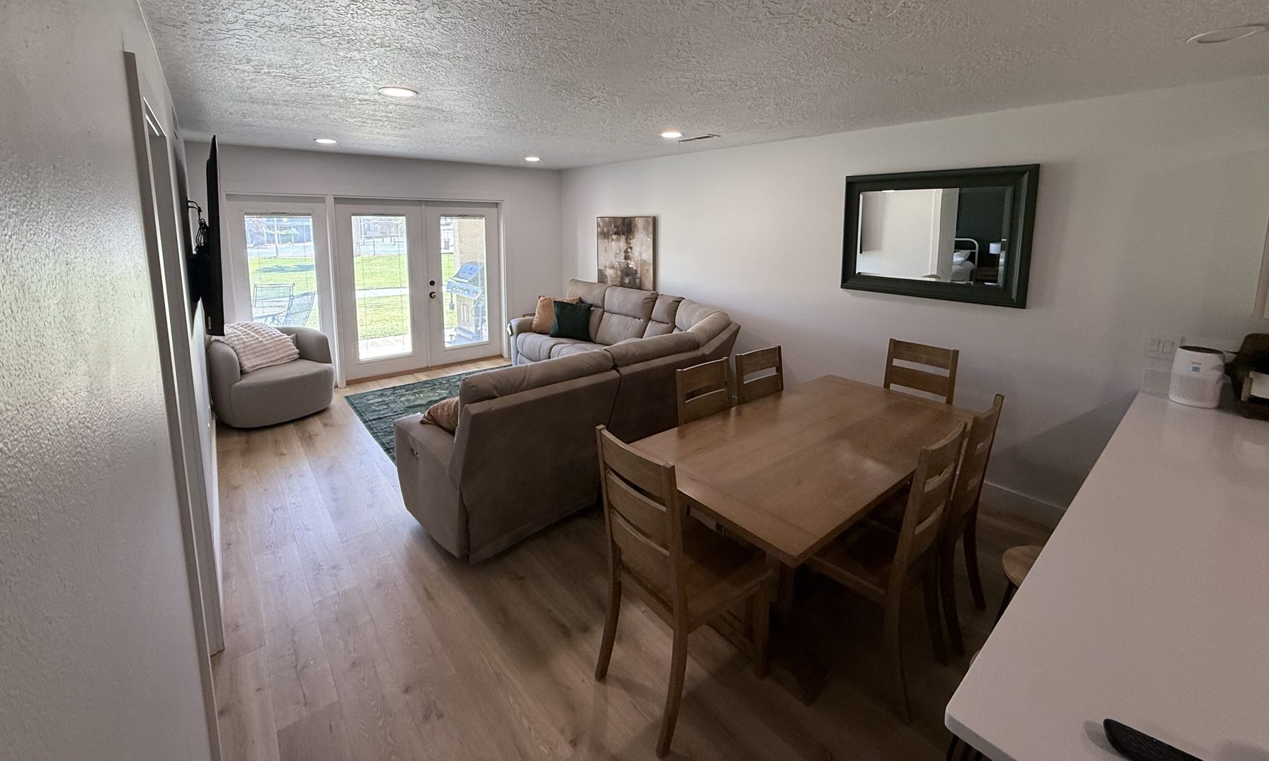 Dining table and living room looking toward the patio
